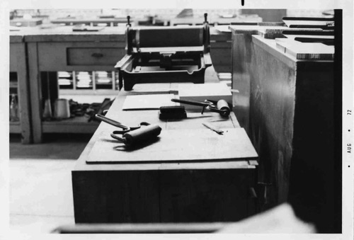 The composing room area of Times Printing in 1972. Type was still being set on Linotypes and this small press was used for pulling proofs from the hot metal lines of type.